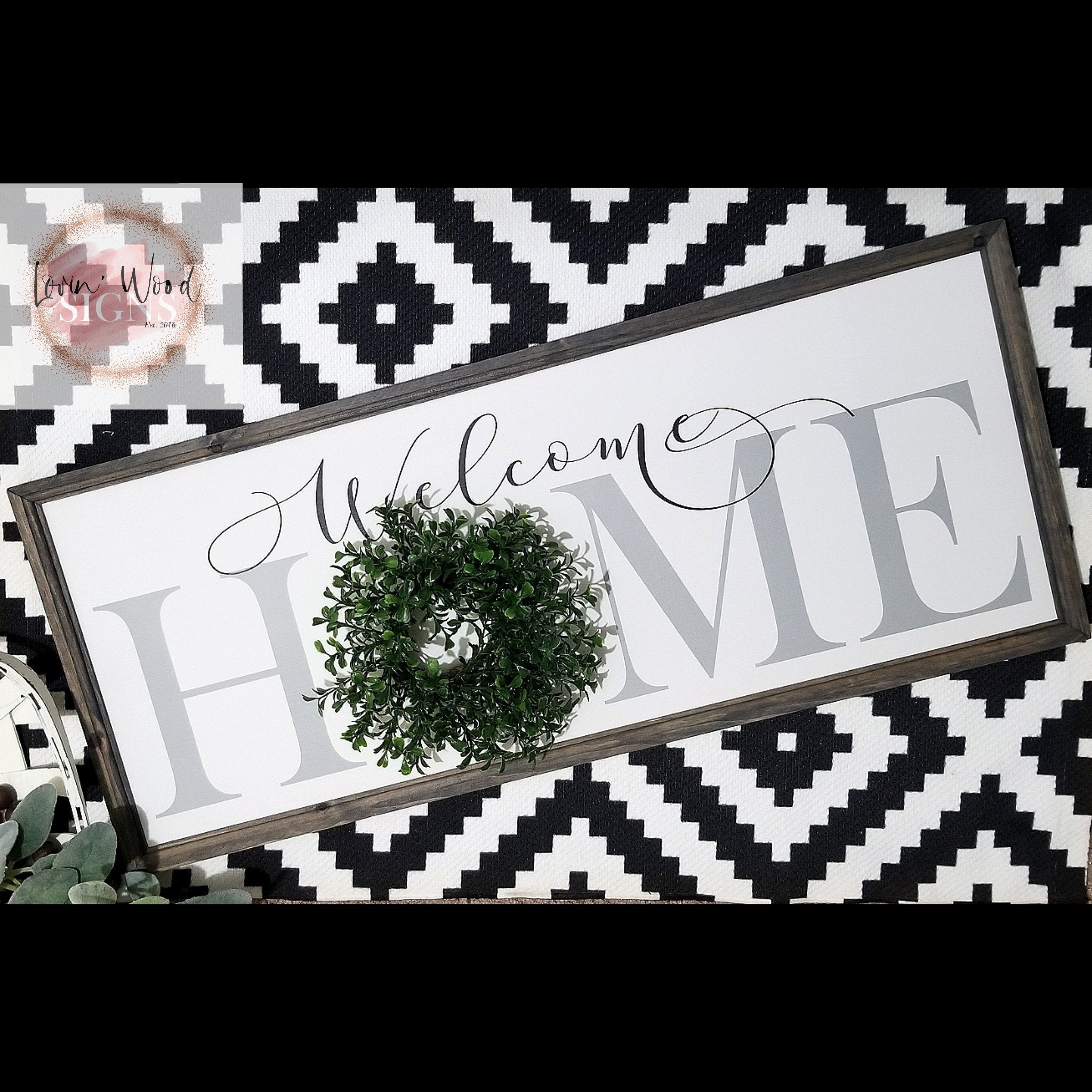 Home sign with wreath